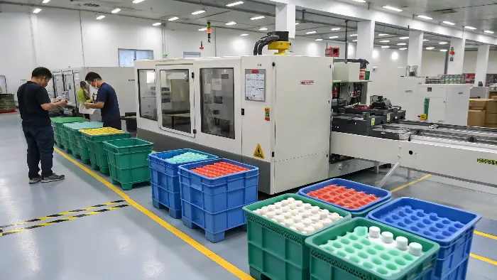 Injection molding machine in operation for adult toy manufacturing